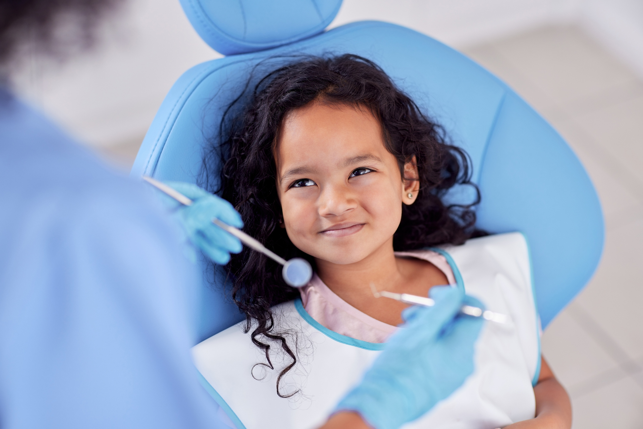 Child receiving dental cleaning